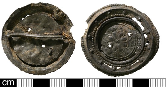 Photograph of lead alloy disc brooch