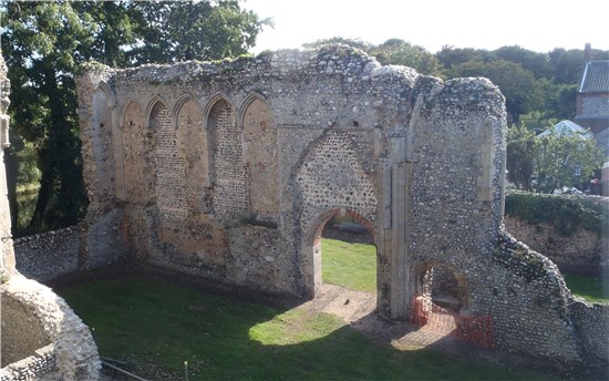 The south wall of the chancel, including 14th century arcading and a 19th century doorway (Norfolk County Council)